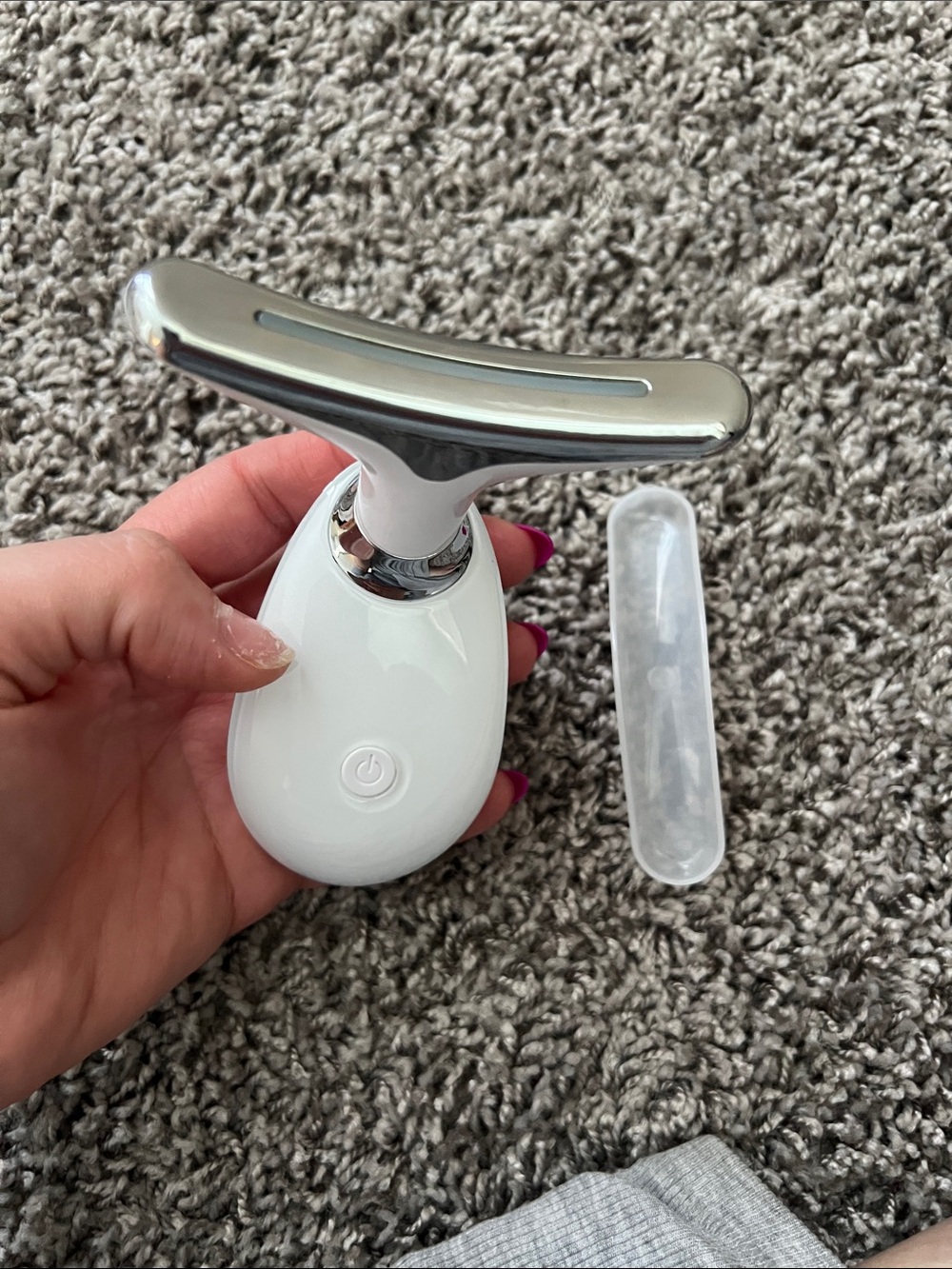 Handheld White Facial and neck Massage Device